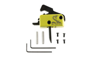 Yellow firearm trigger assembly with screws and tools