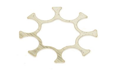 Metallic star-shaped washer on white background.