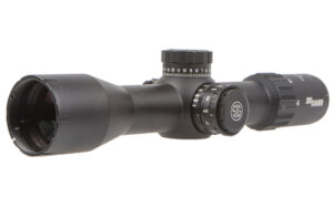 Black rifle scope with adjustment knobs.
