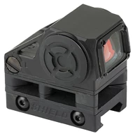 Compact black reflex sight with mounting base.