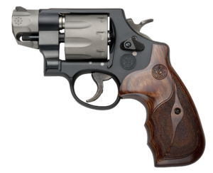 Close-up of compact revolver with wooden grip
