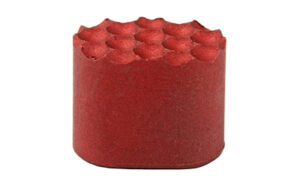 Red cylindrical cake with rounded top decorations