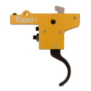 Yellow firearm trigger component with black lever mechanism.