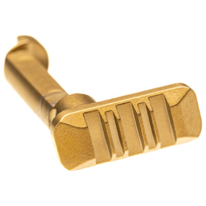 Shiny brass key on white background