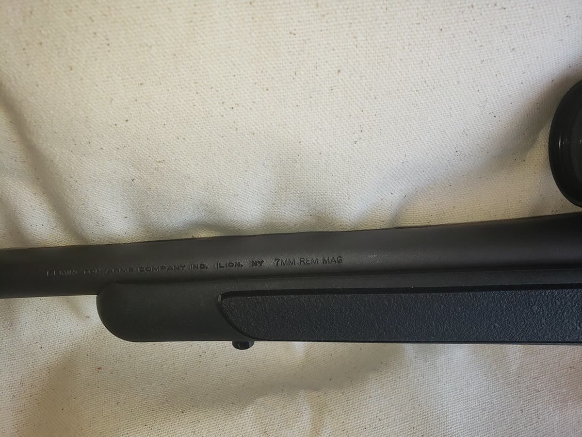 Remington 7mm Remington Magnum bolt-action rifle with scope